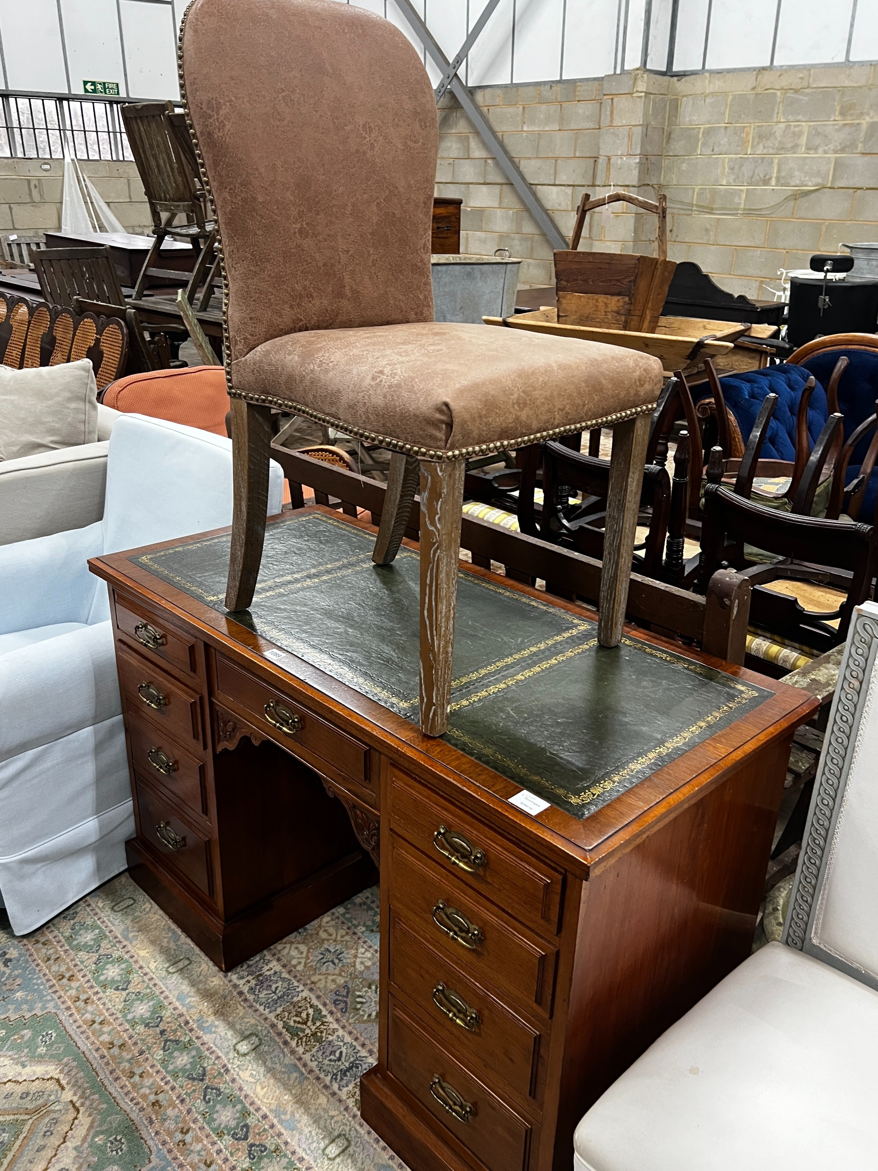 A late Victorian mahogany kneehole writing desk, width 122cm, depth 55cm, height 75cm together with an Oka limed oak chair